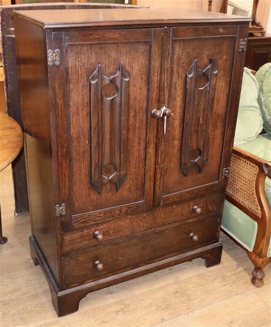 An oak linenfold two door cabinet W.85cm